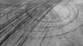 Aerial view tire track mark on asphalt tarmac road race track texture and background, Abstract background black tire track skid on Royalty Free Stock Photo