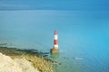 Aerial view to Beachy Head Lighthouse with blue turquoise water of English channel at the background and white chalk stones of cli Royalty Free Stock Photo