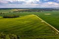 Aerial view to countryside with green agricultural fields and forests Royalty Free Stock Photo