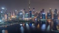 Aerial view to Dubai Business Bay and Downtown with the various skyscrapers and towers all night timelapse Royalty Free Stock Photo