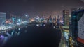 Aerial view to Dubai Business Bay and Downtown with the various skyscrapers and towers all night timelapse Royalty Free Stock Photo