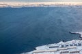 Aerial view to the fjord, Inuit houses and snow street of Greenlandic capital Nuuk city, Greenland