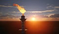 Aerial view to gas flare stack of petroleum refineries sunset background, flare pit tower Royalty Free Stock Photo