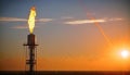 Aerial view to gas flare stack of petroleum refineries sunset background, flare pit tower Royalty Free Stock Photo