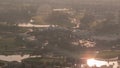 Aerial view to Golf course during sunrise and sun reflected from water in lakes timelapse. Royalty Free Stock Photo