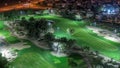 Aerial view to Golf course and villas with houses night timelapse