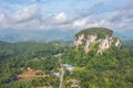 Aerial view to the Limestone hill  Bukit Batu Kapur at Cinta Manis, Pahang, Malaysia. A mountain rock out of nowhere in the middle Royalty Free Stock Photo