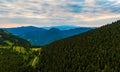 Aerial view to Mala Fatra mountains in Slovakia. Sunrise above mountain peaks and hills in far. Beautiful nature, vibrant colors. Royalty Free Stock Photo