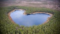 Aerial view to the natural heart-shaped forest lake on Parika nature reserve, Viljandi, Estonia