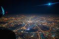 Aerial view to night city from the plane