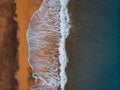 Aerial view to ocean waves and red sand beach Royalty Free Stock Photo