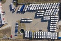 Aerial view to parking lot for autobus and trucks. Industrial background on transportation theme Royalty Free Stock Photo