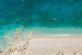 Aerial view to the sandy wild beach with rocky bay