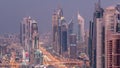 Aerial view to skyscrapers on Dubai downtown and Sheikh Zayed road day to night timelapse, Dubai, United Arab Emirates Royalty Free Stock Photo