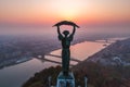 Aerial view to the Statue of Liberty with Liberty Bridge and River Danube at background taken from Gellert Hill on Royalty Free Stock Photo