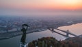 Aerial view to the Statue of Liberty with Liberty Bridge and River Danube at background taken from Gellert Hill on Royalty Free Stock Photo