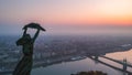 Aerial view to the Statue of Liberty with Liberty Bridge and River Danube at background taken from Gellert Hill on Royalty Free Stock Photo