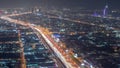 Aerial view to traffic on Sheikh Zayed road and intersection night timelapse, Dubai, United Arab Emirates Royalty Free Stock Photo