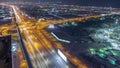 Aerial view to traffic on Sheikh Zayed road and intersection night timelapse, Dubai, United Arab Emirates