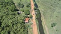 Aerial view to Transpantaneira dirt road through typical rural landscape, Pantanal Wetlands, Mato Grosso, Brazil