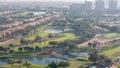 Aerial view to villas and houses with Golf course with green lawn and lakes timelapse Royalty Free Stock Photo