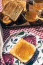 Aerial view of a toast with peach jam and a wooden board with toasts Royalty Free Stock Photo