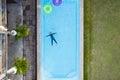 Aerial view or top view of child is swimming in swimming pool Royalty Free Stock Photo