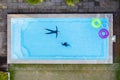 Aerial view or top view of children are swimming in swimming pool Royalty Free Stock Photo