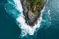 Aerial view Top down seashore big wave crashing on rock cliff Beautiful dark sea surface in sunny day summer background Amazing Royalty Free Stock Photo