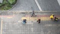 Aerial view and top view with people walk in business area with pedestrian street and red and yellow block walkway Royalty Free Stock Photo