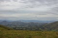 Aerial view from the top of Pyrenees mountains. Scenic landscape with clouds. Summer nature in France. Panoramic view of mountains Royalty Free Stock Photo