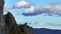 Aerial view of the top of a rocky mountain on a background of clouds Royalty Free Stock Photo
