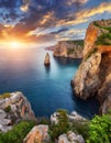 Aerial view top seashore, rocky coast, waves crashing on rock cliff. Blue ocean surface sunny summer Royalty Free Stock Photo