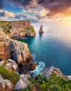 Aerial view top seashore, rocky coast, waves crashing on rock cliff. Blue ocean surface sunny summer Royalty Free Stock Photo