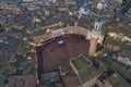 Aerial view of Torre del Mangia with city skyline at sunset, a famous landmark in Piazza del Campo, Siena, Tuscany, Italy Royalty Free Stock Photo