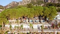 Aerial view of tourist hotel with with planted pines in resort village Turunc in Turkey. Hotel on the first line to the