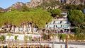 Aerial view of tourist hotel with with planted pines in resort village Turunc in Turkey. Hotel on the first line to the