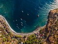 Aerial view of tourist town with blue sea water and boats, drone view in Bali Royalty Free Stock Photo