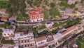 Aerial view of the touristic city, the mountains road, cars and baus, building the beach, hotels and restaurants, buildings, busin