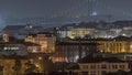 Aerial view towards Barrio Alto and 25th of April Bridge night timelapse, Lisbon, Portugal. Royalty Free Stock Photo