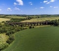 An aerial view towards the Victorian railway viaduct at John O`Gaunt valley, Leicestershire, UK