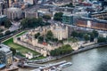 Aerial view of Tower of London and city skyline at night