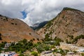 Aerial view of towering, cloud covered mountains at the exit of the Samaria Gorge Agia Roumeli, Crete