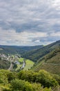 Aerial view, town of Bourscheid with its houses, a rural road and a river between mountains Royalty Free Stock Photo