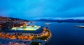 Aerial view of town center in Molde, Norway at night. View of the illuminated stadium