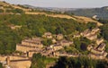 aerial view of the town of hebden bridge in summer with hillside sloping streets of stone house surrounded by green woods Royalty Free Stock Photo