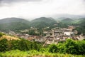 Aerial view of a town in the green Tennessee Mountains on a foggy day