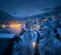 Aerial view of town in snow, road, forest, lake and houses Royalty Free Stock Photo
