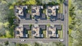 Aerial view of a townhouse village / gated community in the foggy morning, 3d render