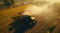 Aerial view of a Tractor fertilizing a cultivated agricultural field Royalty Free Stock Photo